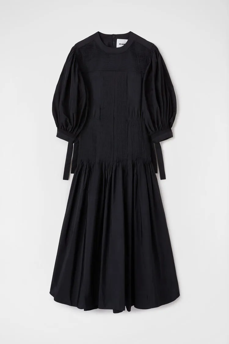 Long dress with pintucks on shoulders and skirt